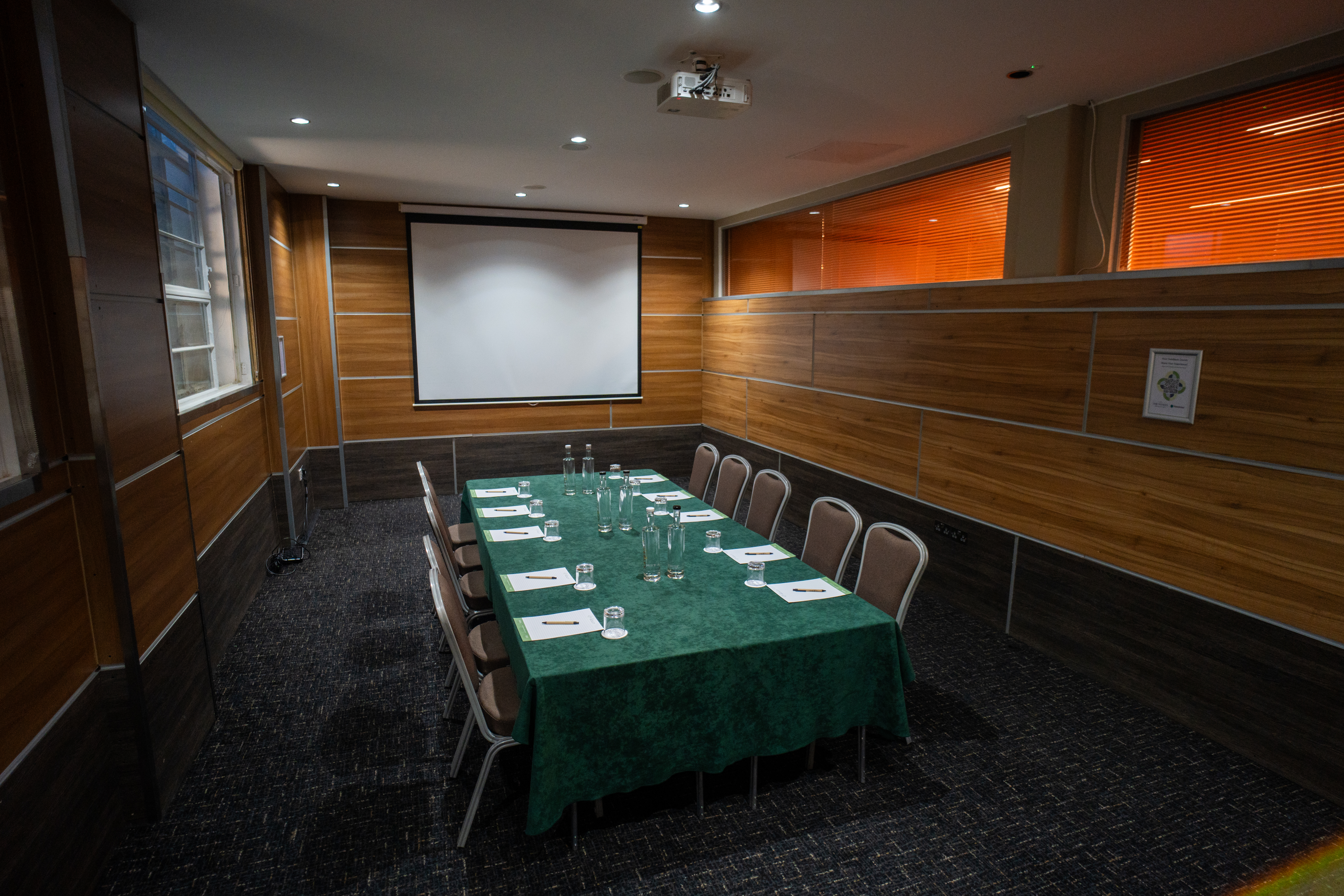 Meeting room at The Wesley set up with pens and notepads