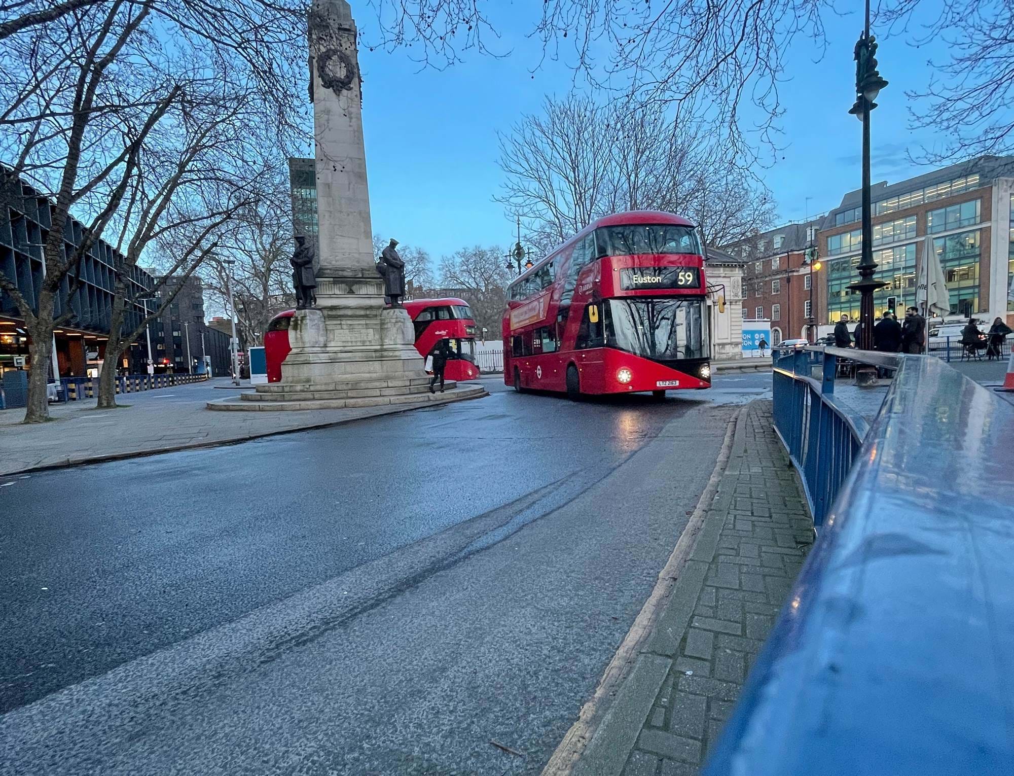 A London bus driving through central london near The Wesley Hotel