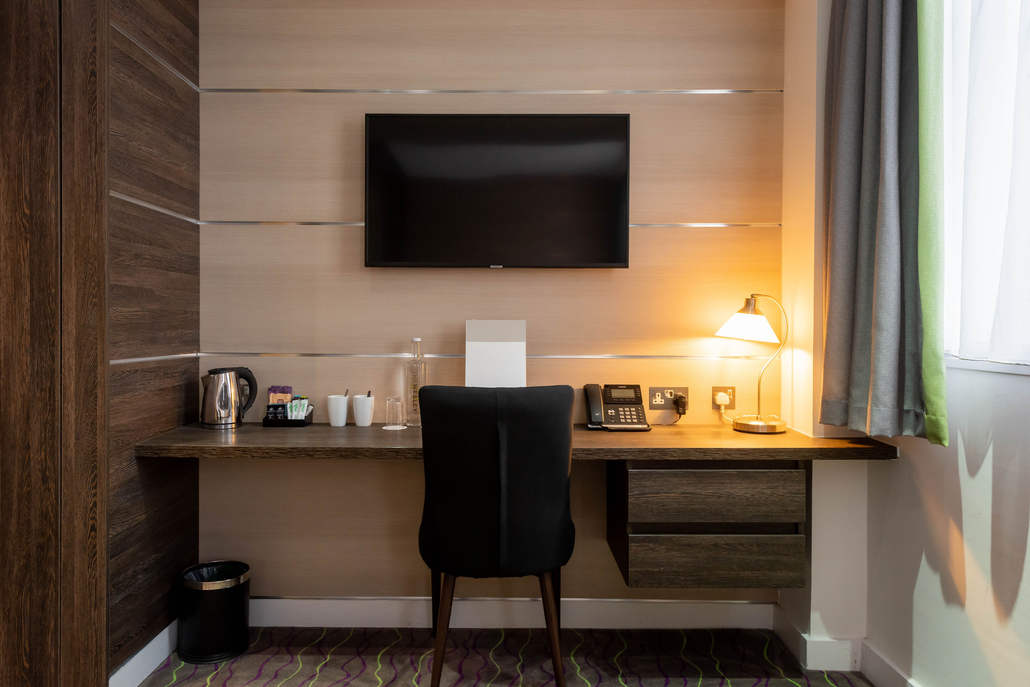The counter top and tv in The Wesley Euston's double bedroom