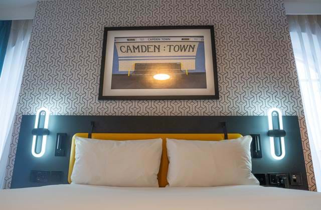 Bedroom with bed and pillows at The Wesley