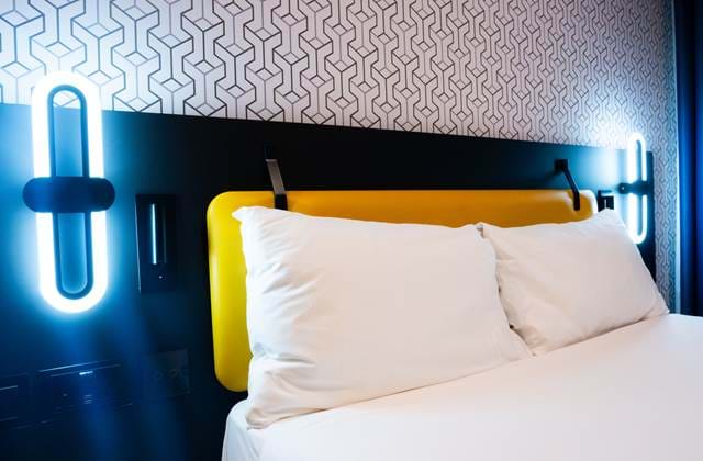 Bedroom with bed and pillows at The Wesley