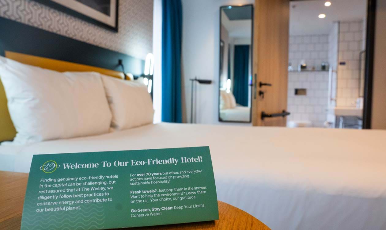 Bedroom with bed and pillows at The Wesley