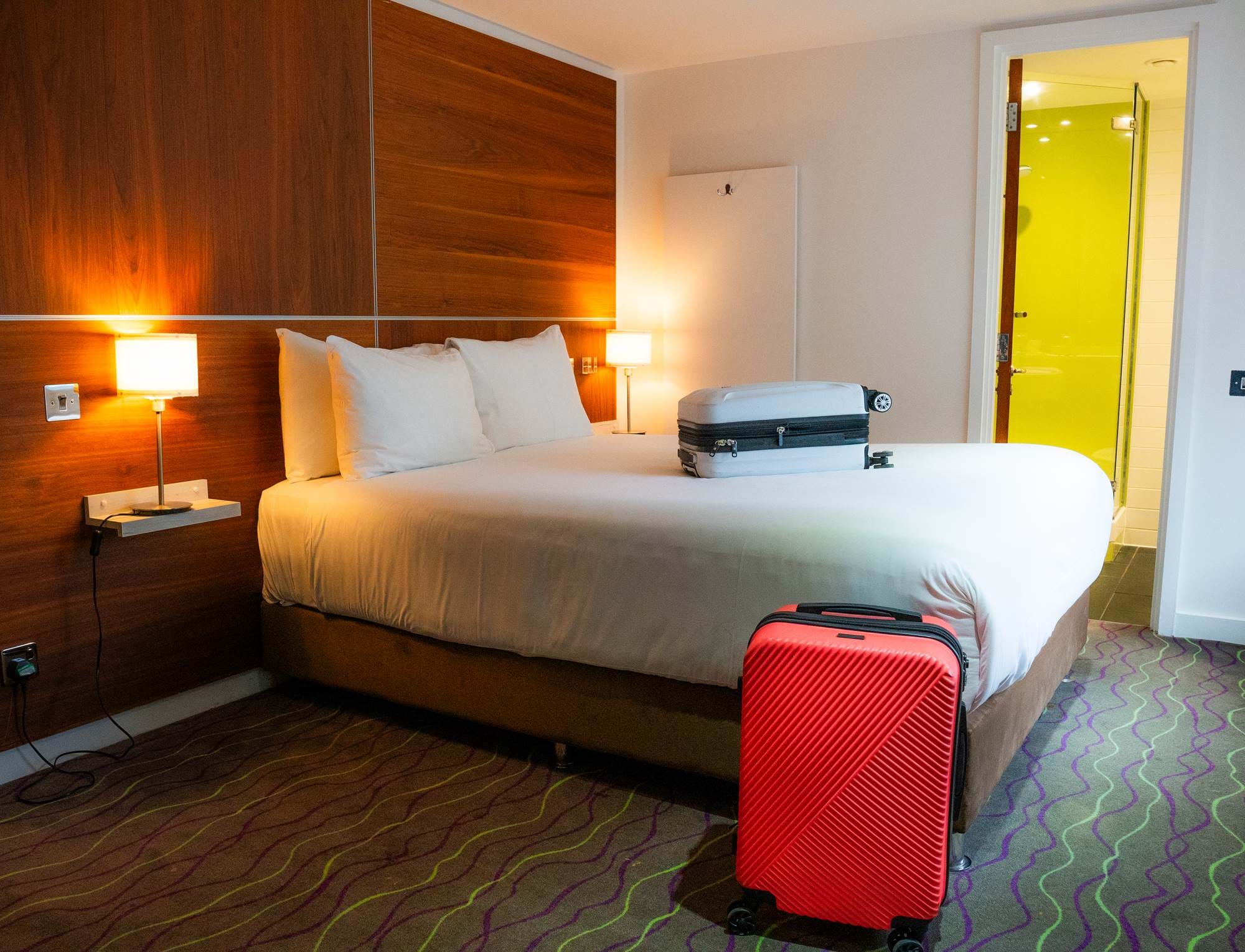 Suitcases on the bed at The Wesley